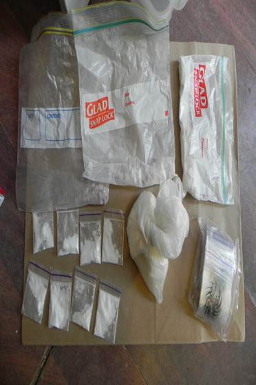 Search warrants reveal drugs, weapons, ammunition and cash