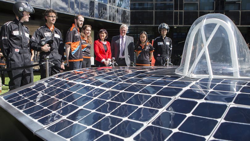 solar car and onlookers