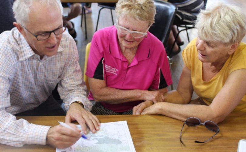 Prime Minister Malcolm Turnbull chatting to Margaret Evens of Kalaru and her friend Fleur Dwyer. Photo: Ian Campbell.