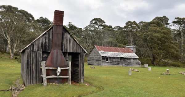 Snowy Hydro to pay $300,000 to rebuild fire-destroyed huts after sinkhole forms in national park