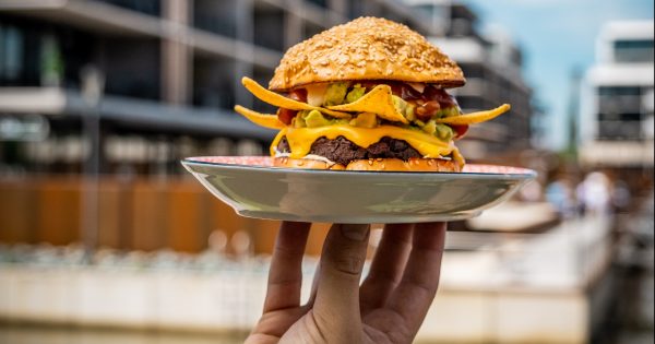Bad Betti celebrating her breakup with 150 free burgers on National Burger Day