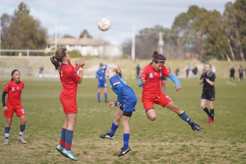 Girls playing football