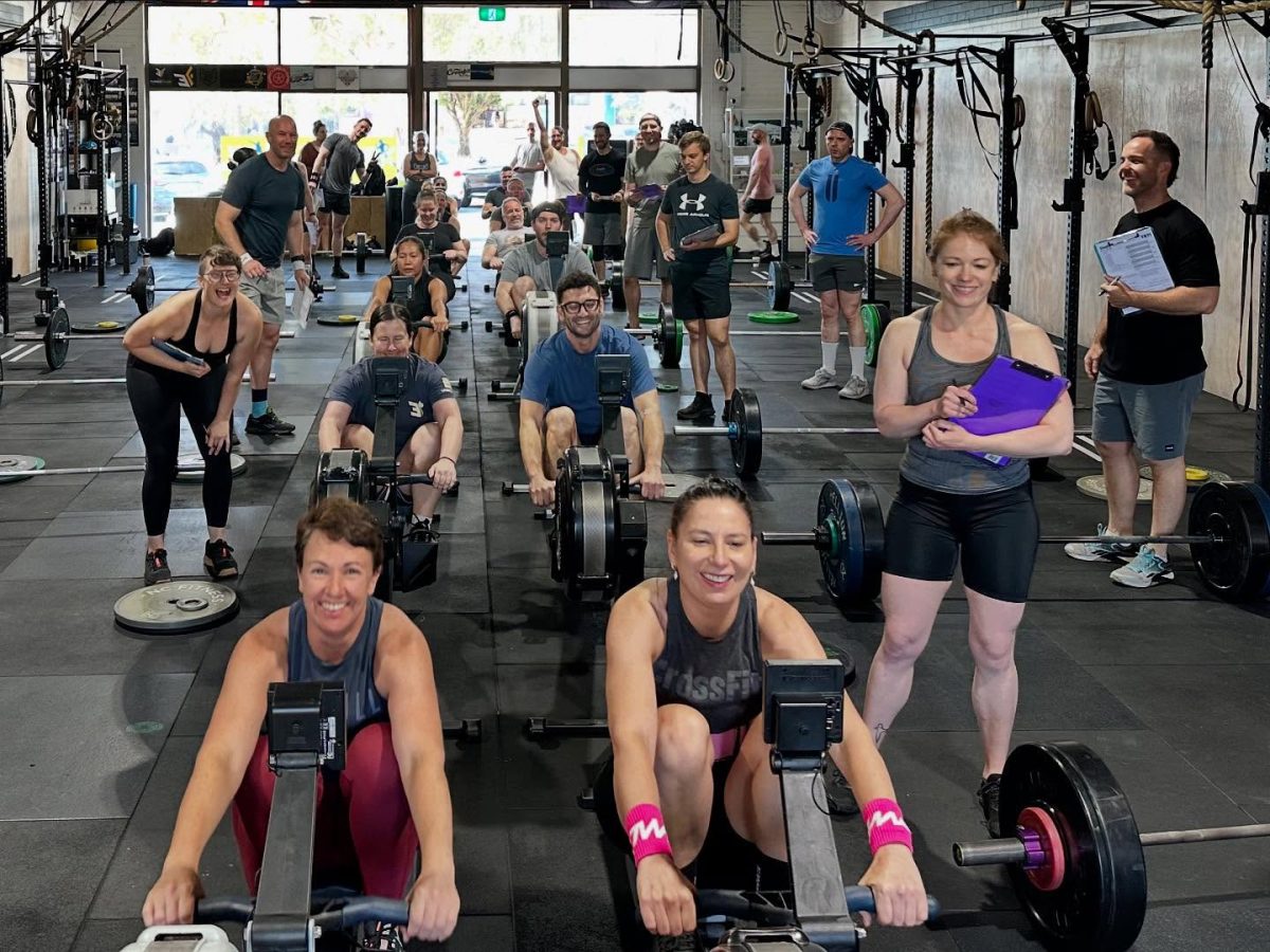 a group of people completing a workout in a gym