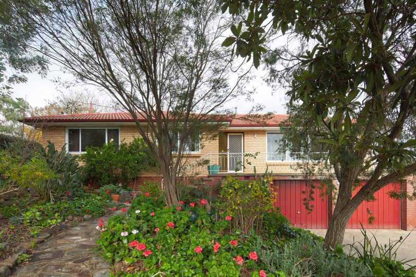 The home at Vest Place is set among lush gardens.