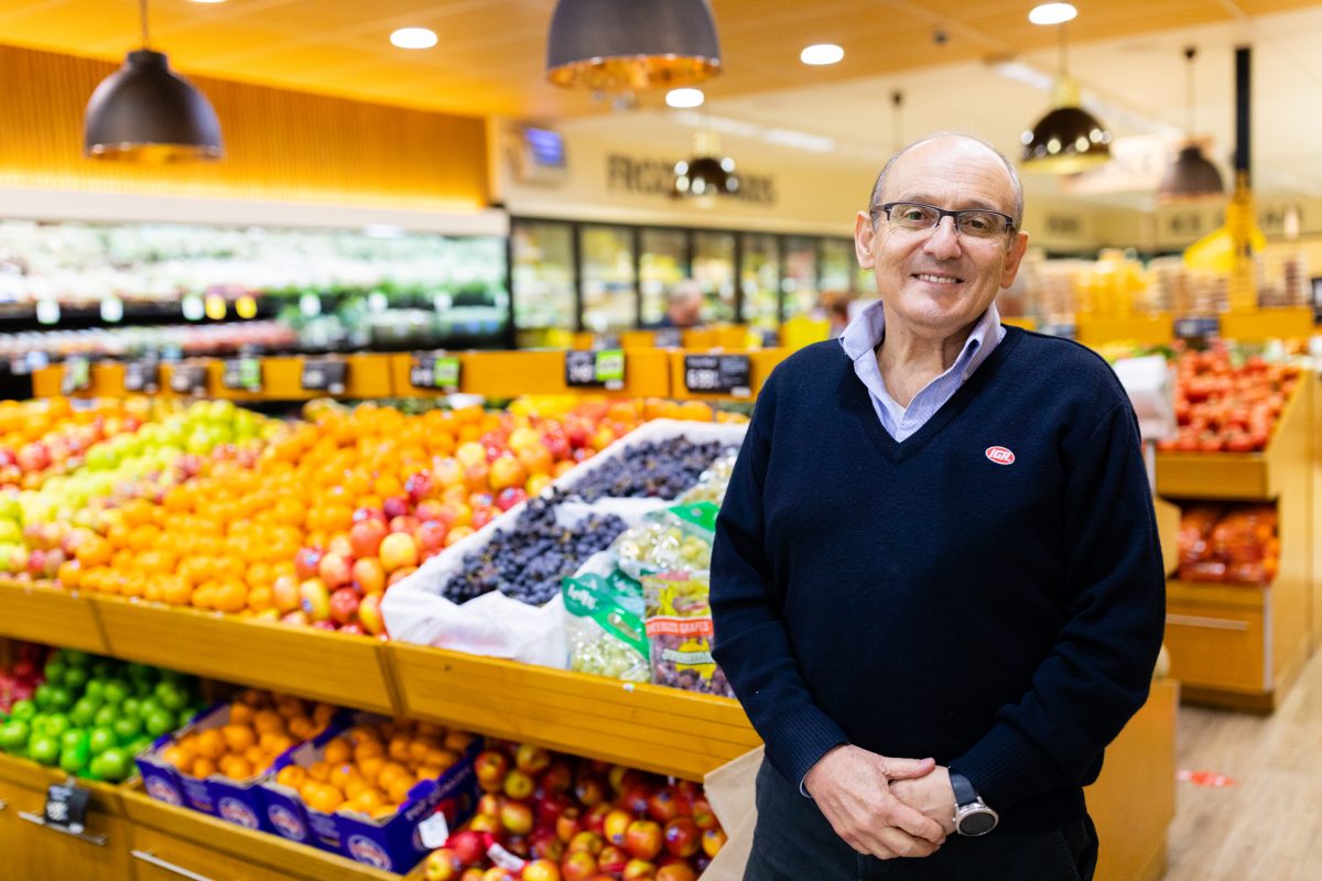 Man in front of produce