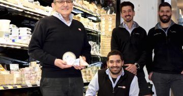 Manuel's back 'home' at Ainslie IGA and its famous wall of cheese