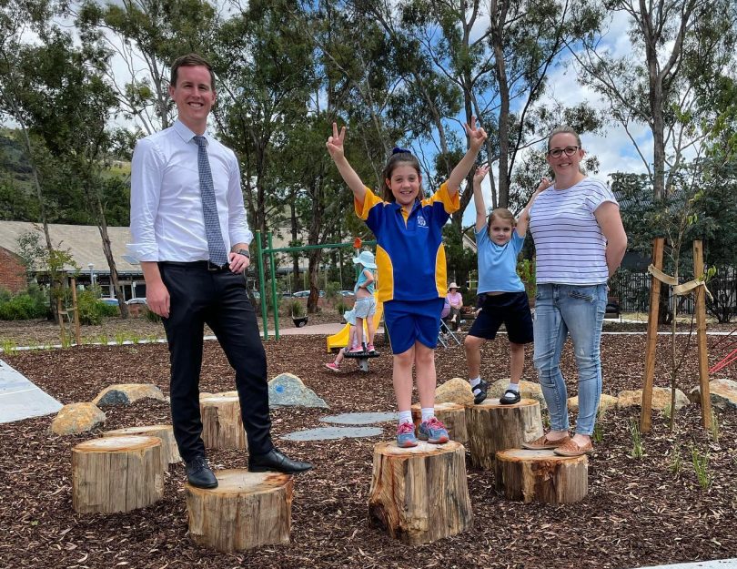 Chris Steel with families at a playground