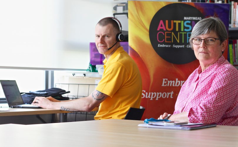Adam King and Helen Gardner at Marymead's autism call centre at Narrabundah.