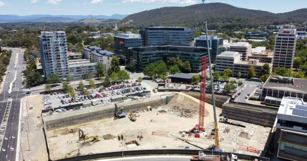 Why is there a crane on stalled city building site?