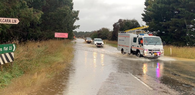 Members of the SES Queanbeyan Unit evacuate teachers from Captains Flat this morning.