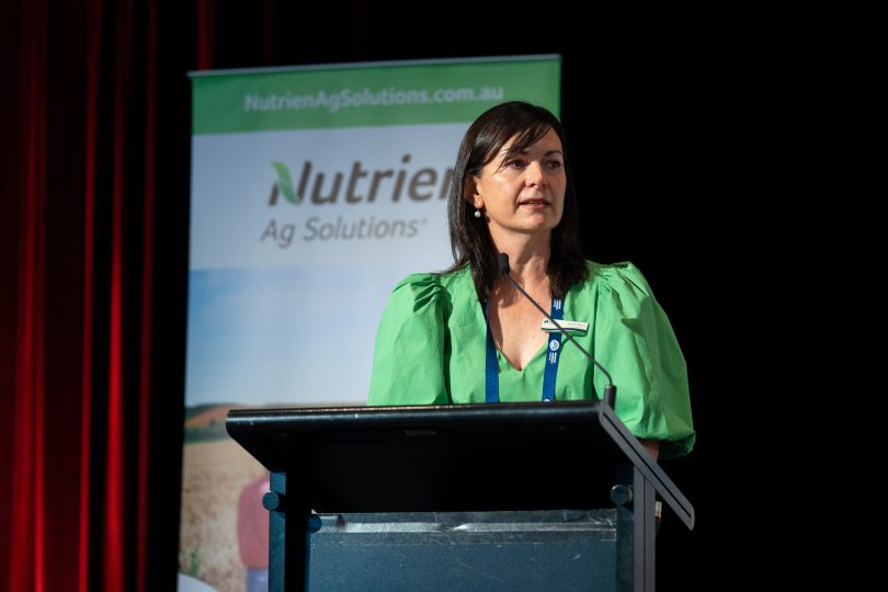 Rachel Whiting speaking onstage at podium