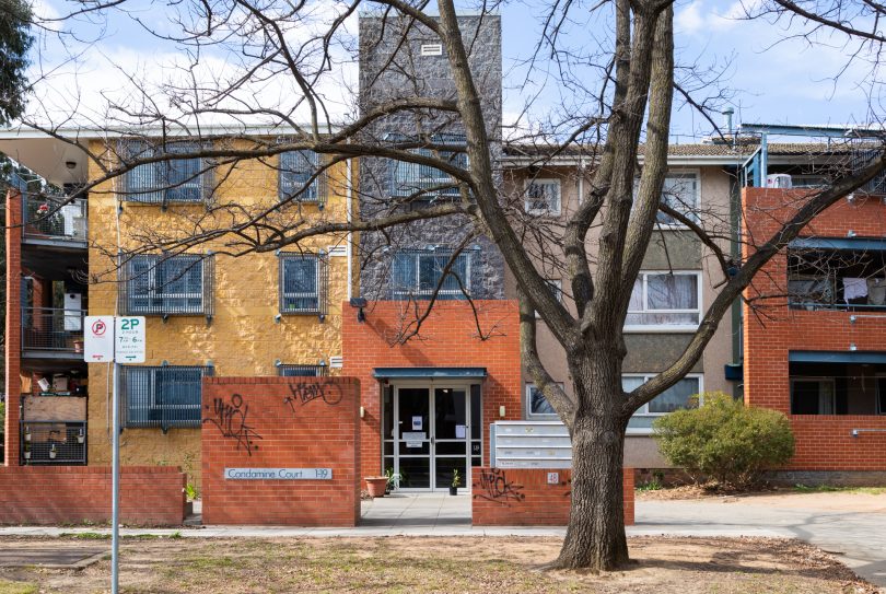 Apartment building with graffiti