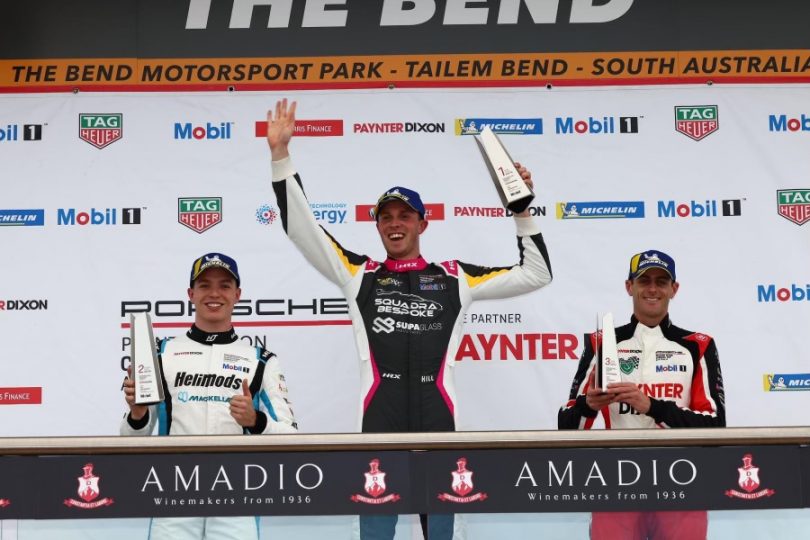 Cameron Hill with trophy on podium