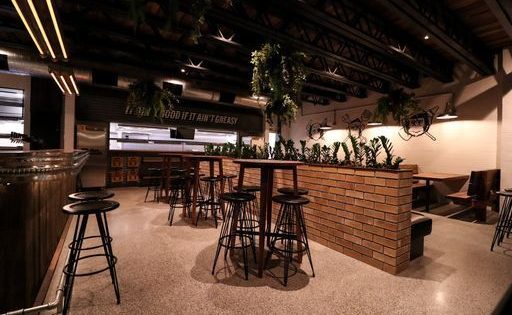 Five hundred free burgers to celebrate Grease Monkey's new home in Woden