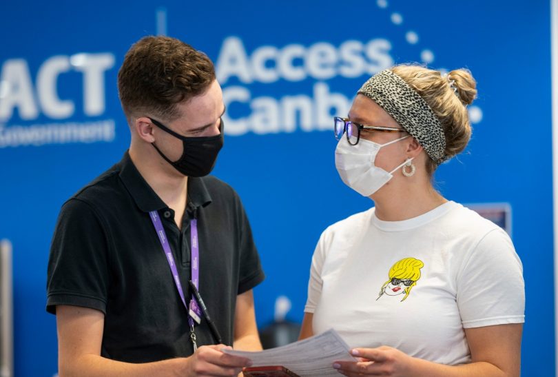 People talking wearing masks
