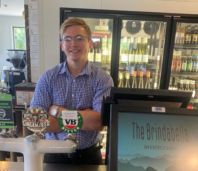 Travis Neusch behind the bar