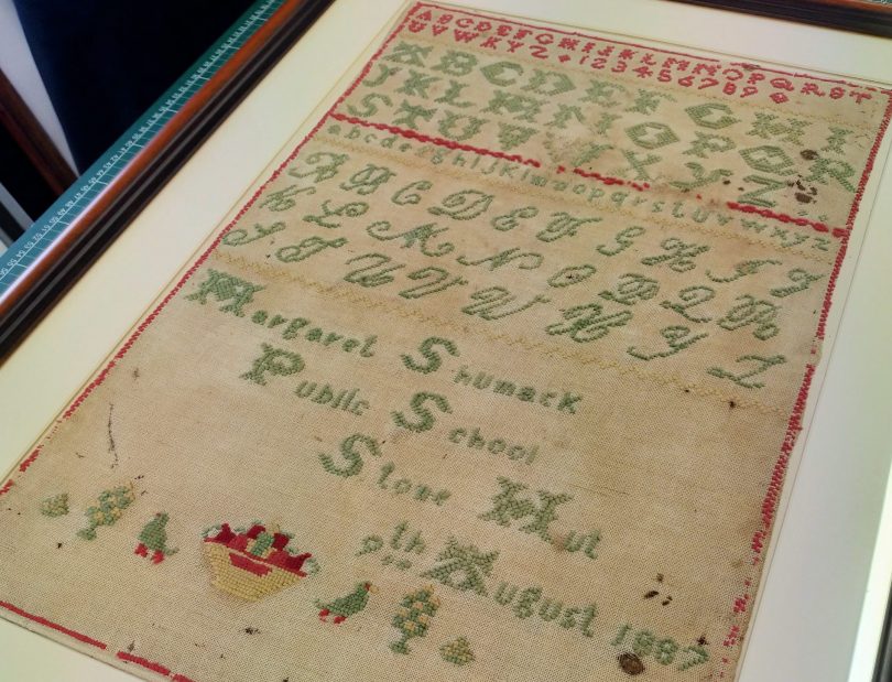 Old sampler of needlework