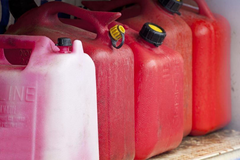 jerry cans on a shelf