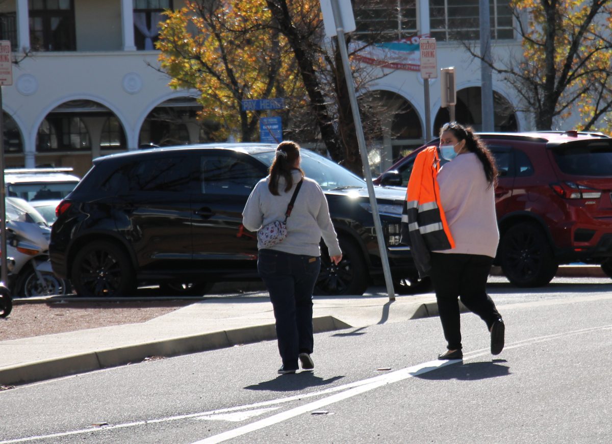 Woman walking across road