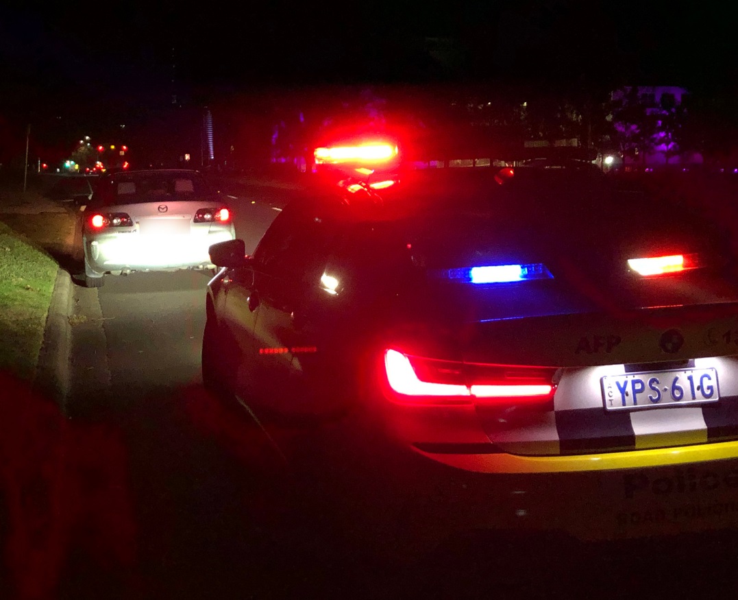White car pulled over by police