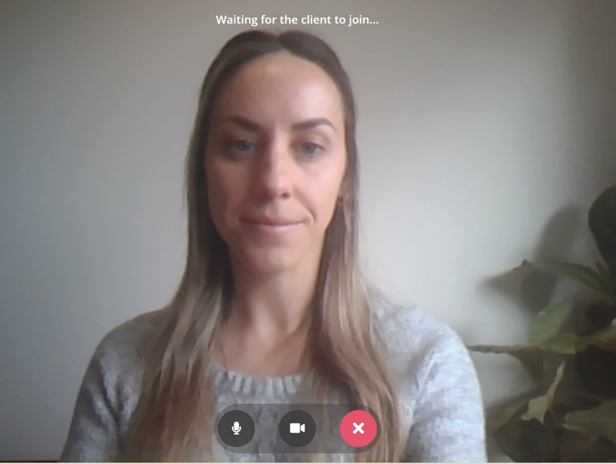 Screenshot of woman on telehealth call