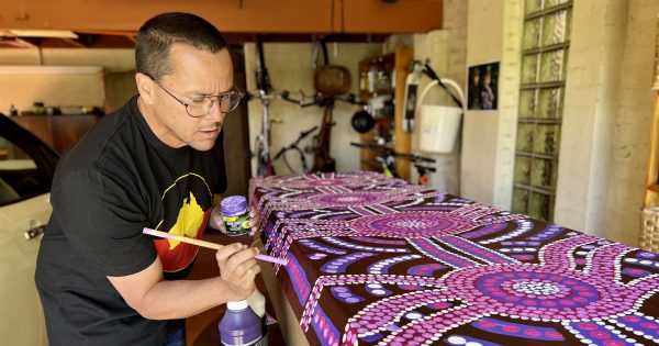 Forget $3000 caskets, meet the guy who paints cardboard coffins in Canberra