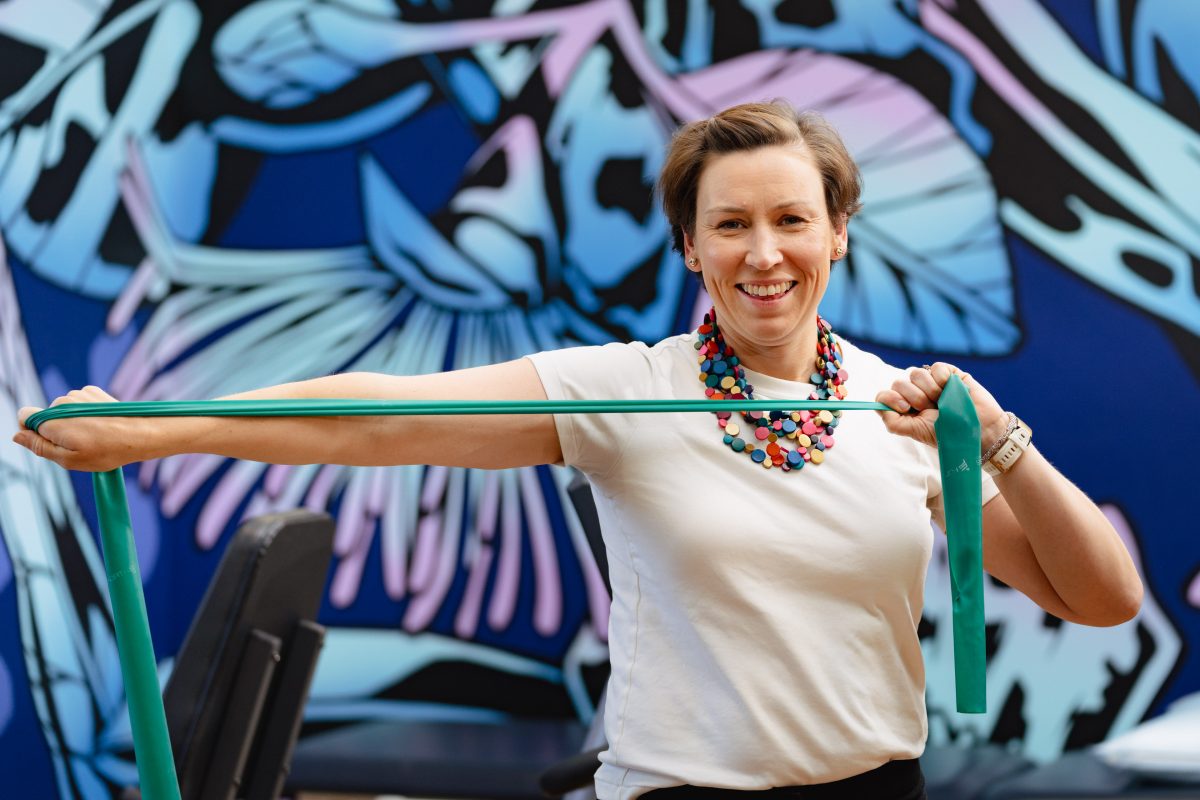 Cancer patient Cassandra Bennett does a simple exercise at the UC Cancer Wellness Centre