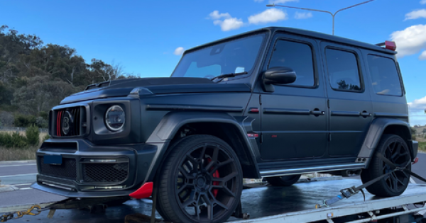 Mercedes, Harley seized as police raid Googong home