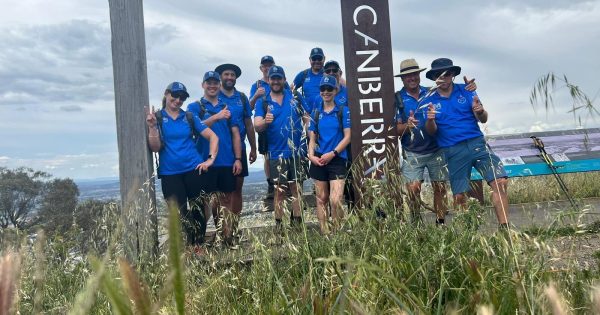 Down comes the rain, Menslink walkers' spirits remain high (although their feet are very wet)