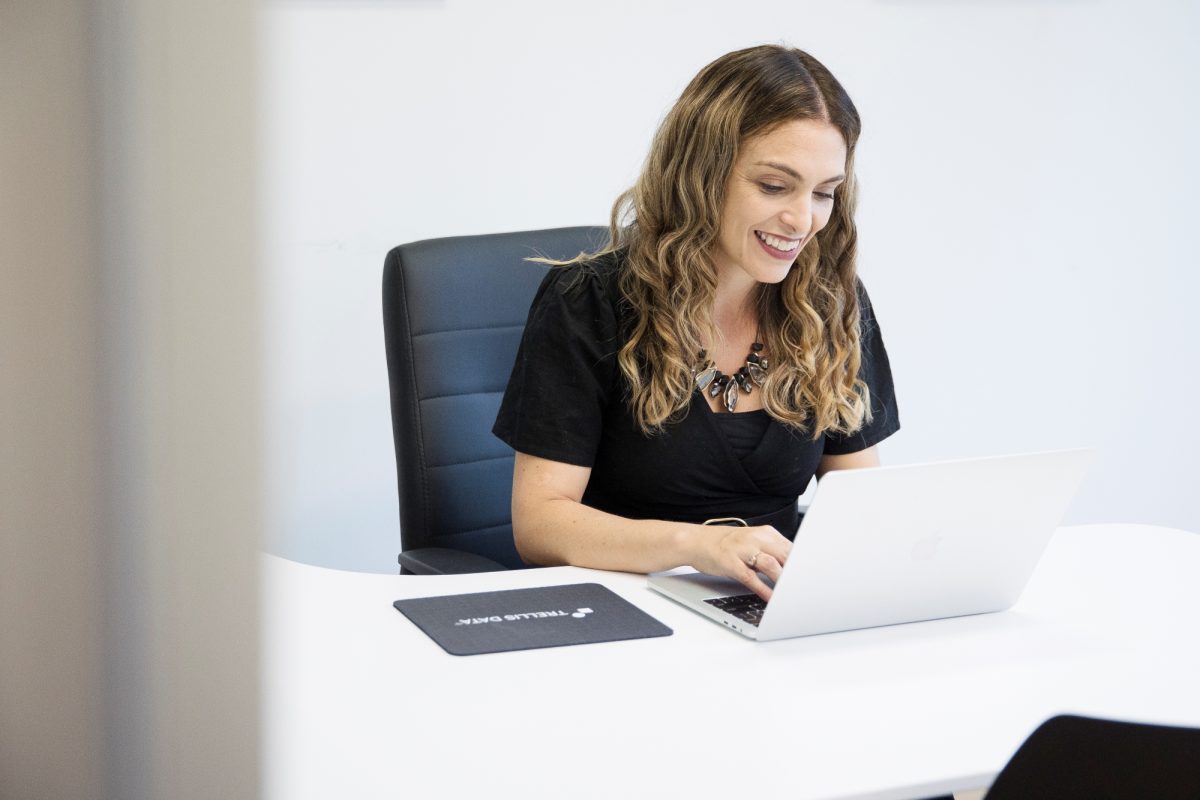 Woman sitting at desk on laptop