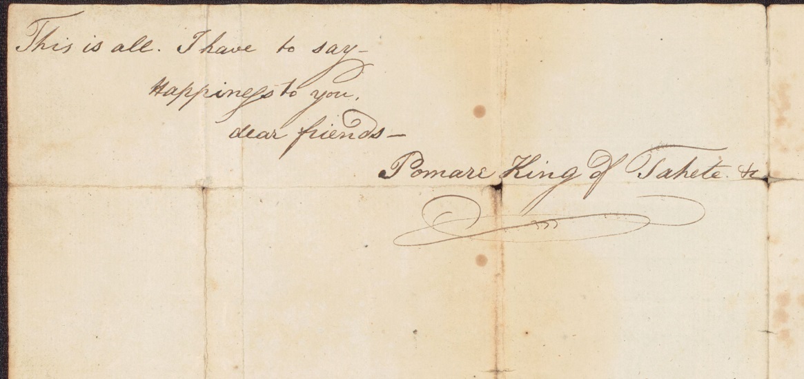 An aged piece of paper with cursive writing on it