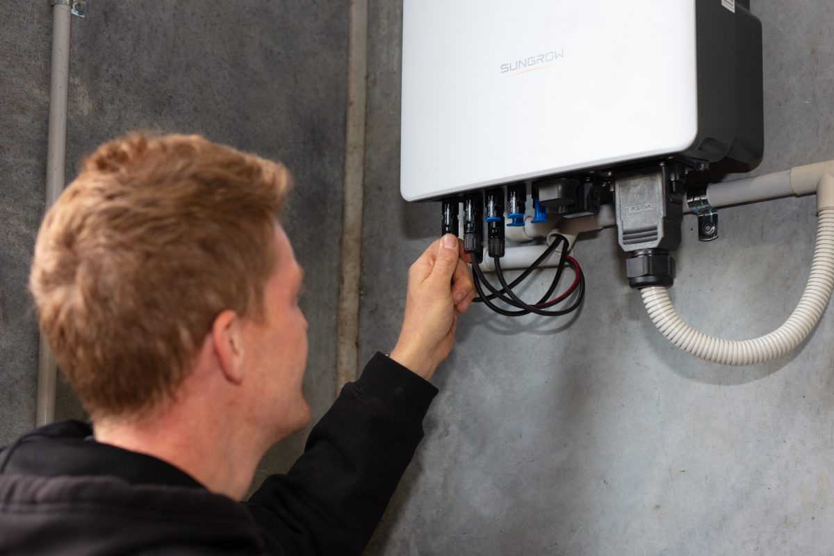 man inspecting battery system