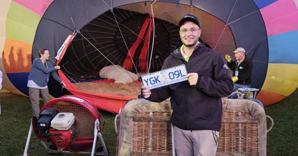 'Lucy' pilot collects a numberplate from every place he flies, and now that includes the ACT