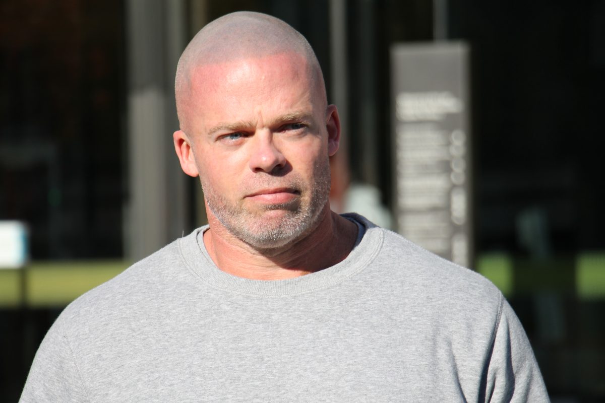 man leaving court in T-shirt