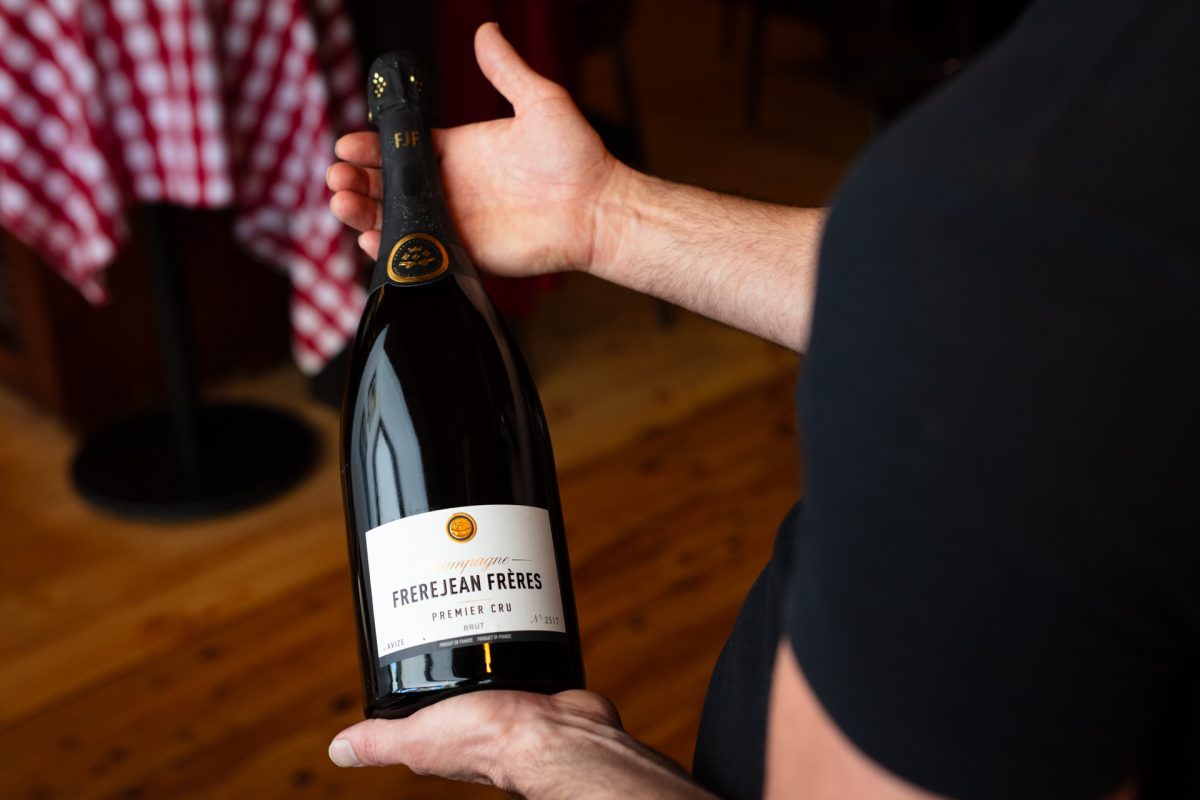 A man holding Champagne