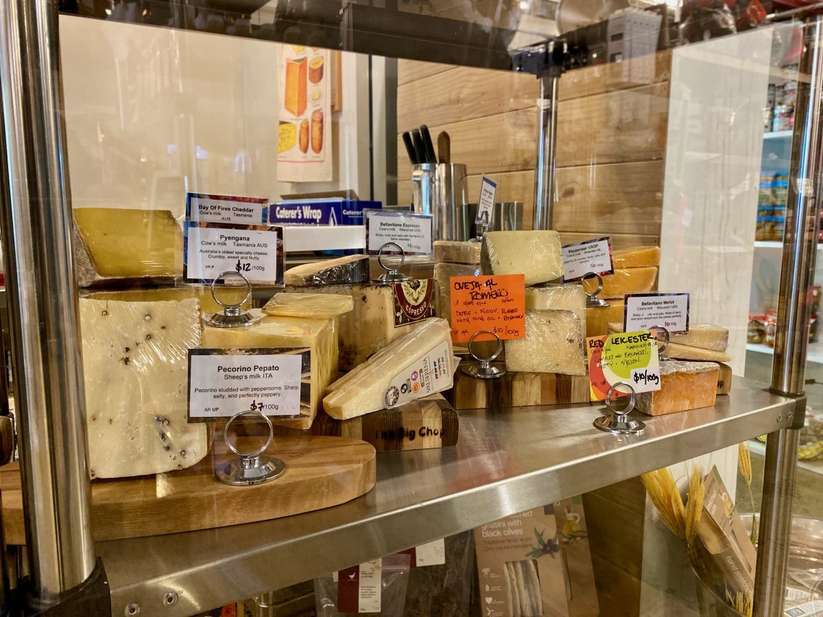 A display of cheeses for sale.