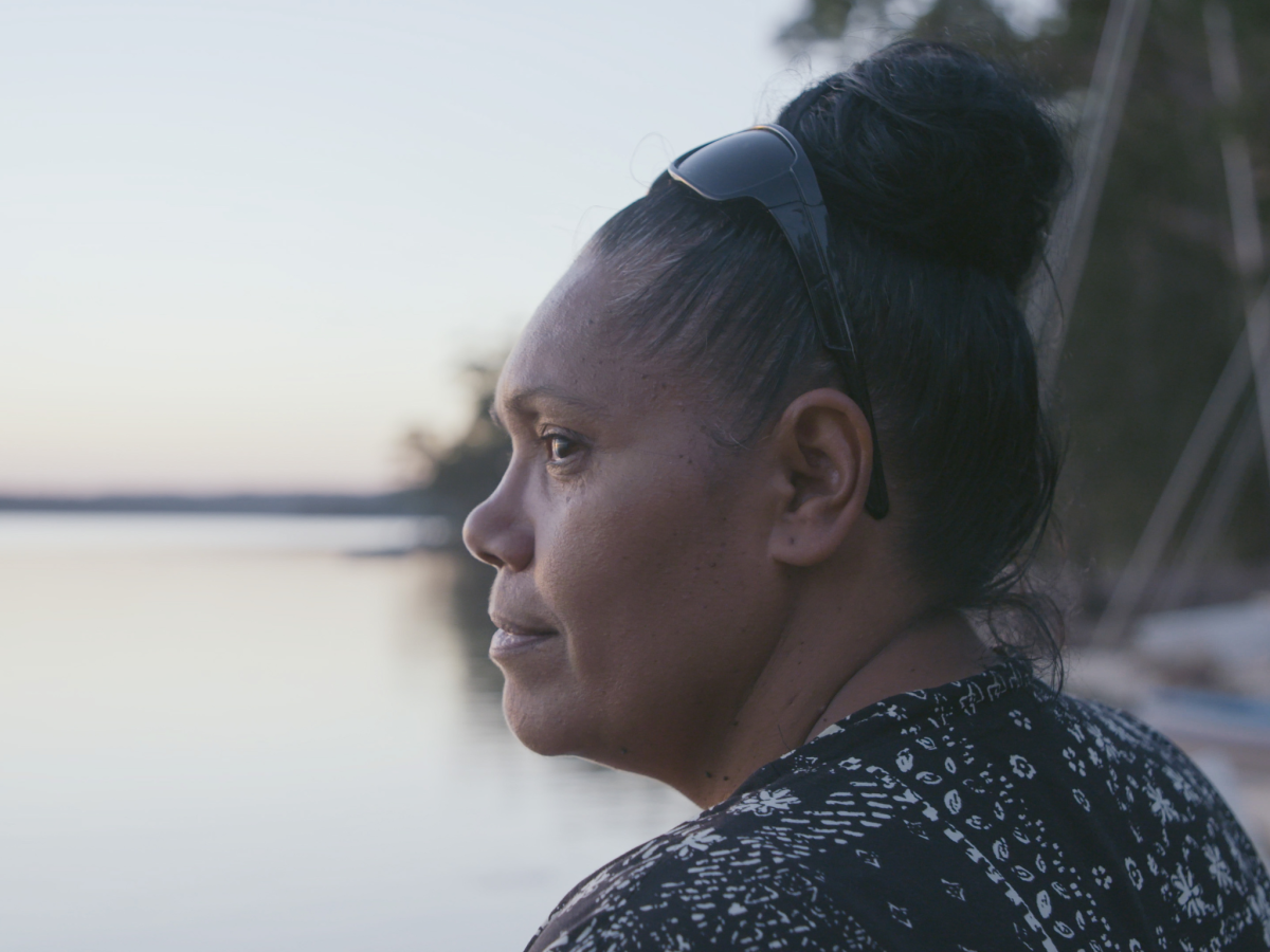 Still from The Last Daughter showing a woman looking out over a body of water