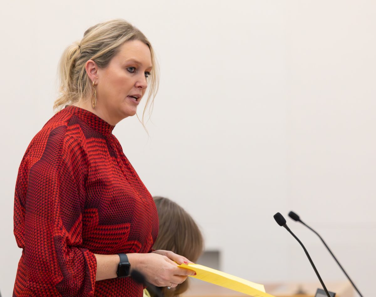 Woman speaking into microphone