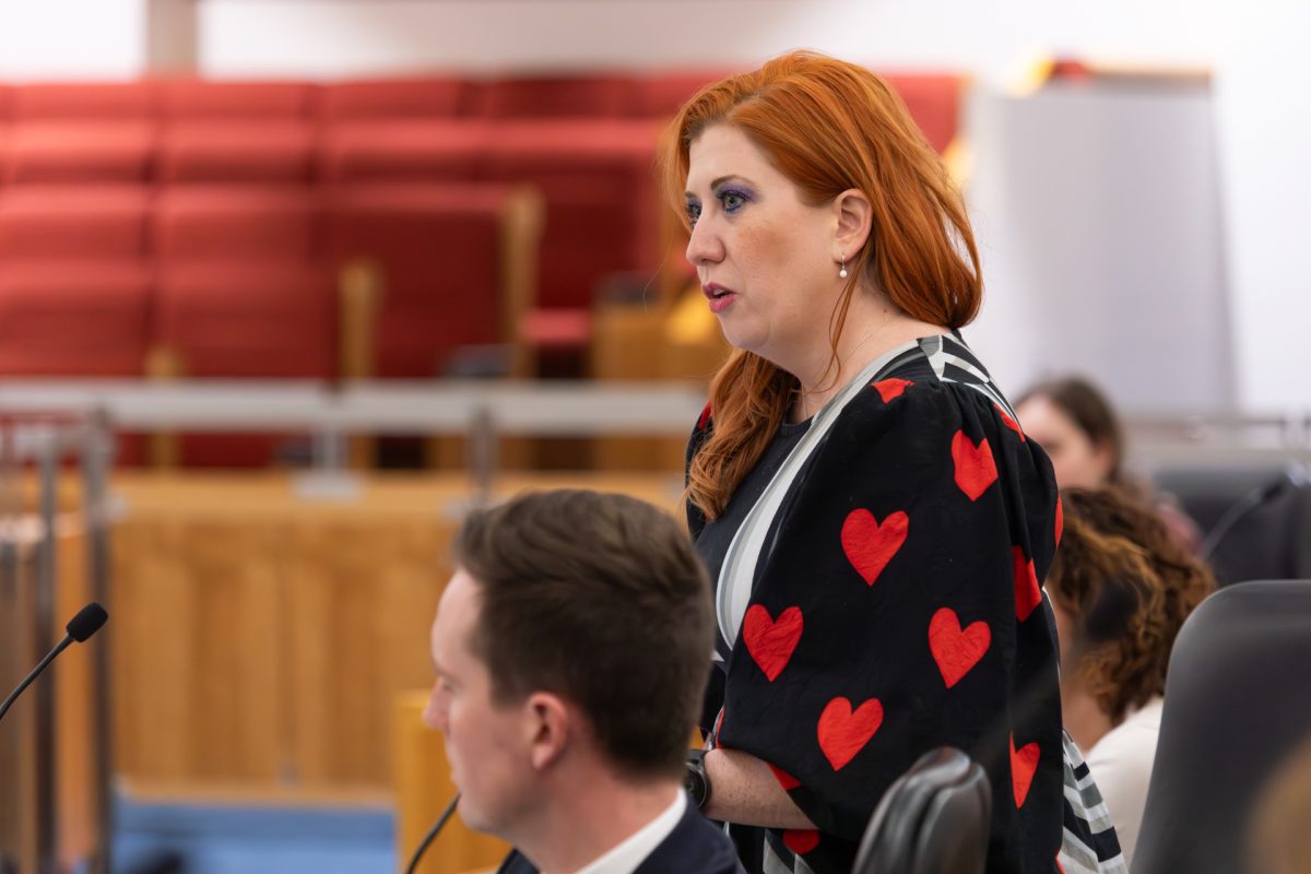 Woman speaking into microphone