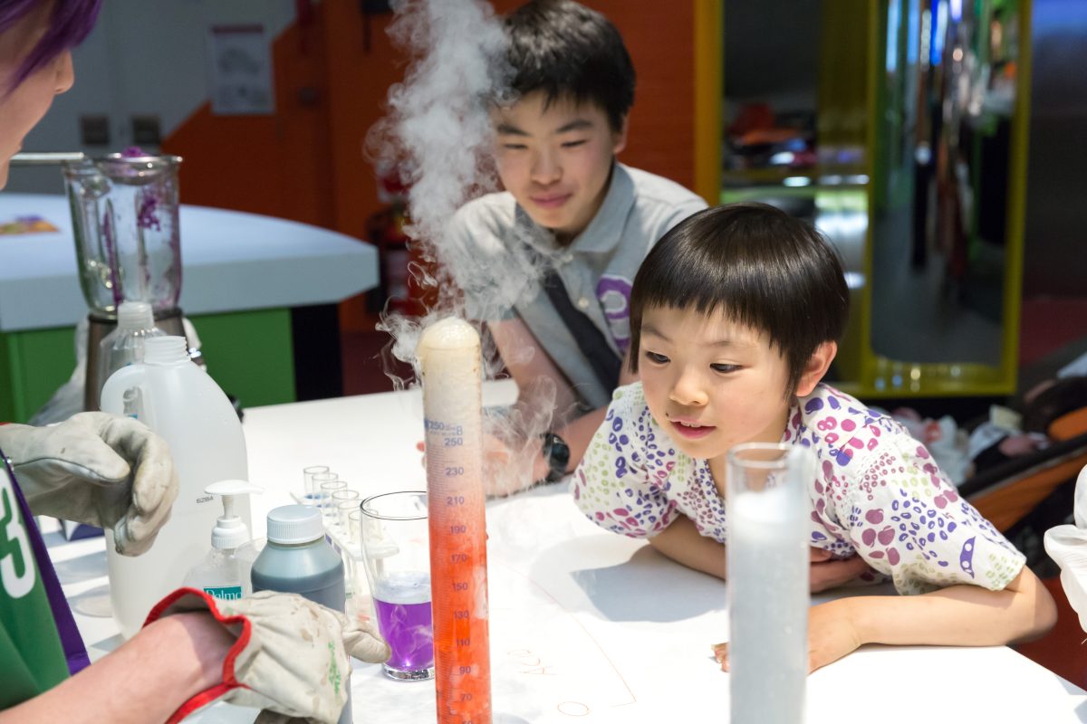 Young kids at Questacon looking at a science project
