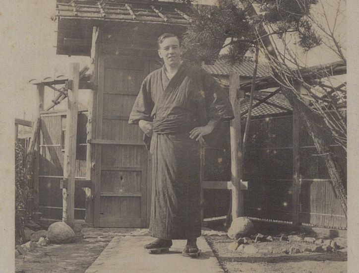 A sepia photograph of a gentleman in traditional Japanese attire.
