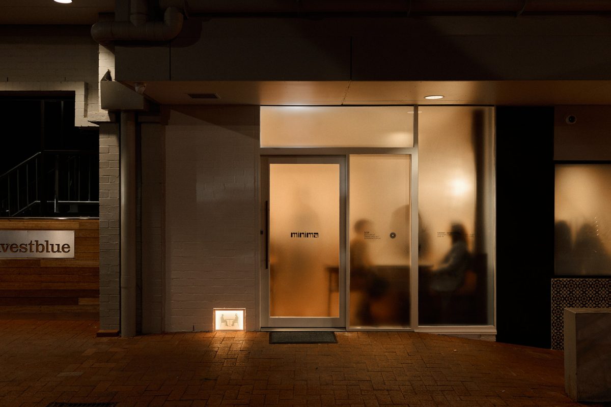 Restaurant lit up at night.