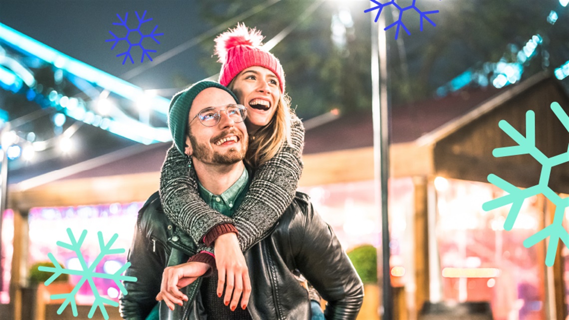 a person giving another person a piggy back