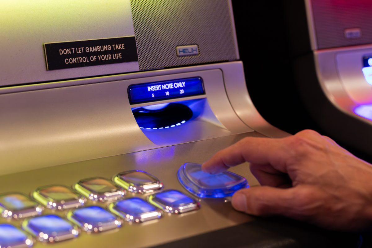 Person playing a poker machine