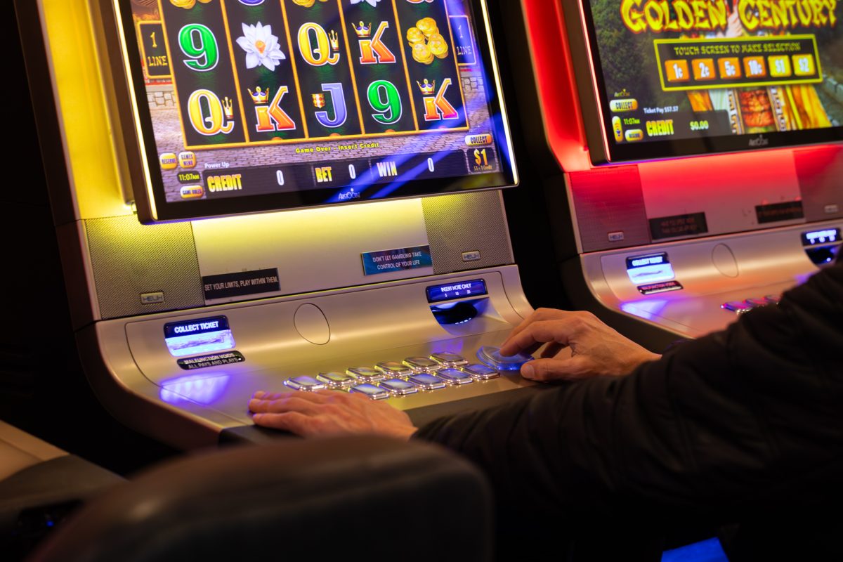 Person playing on a poker machine