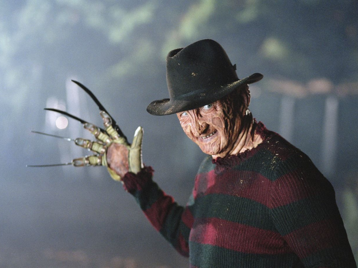 Still from A Nightmare on Elm Street showing a man wearing a glove with knives