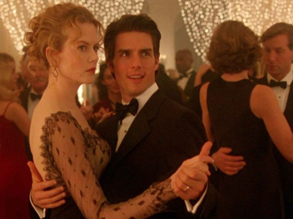 Still from Eyes Wide Shut showing a cocktail party with couples dancing