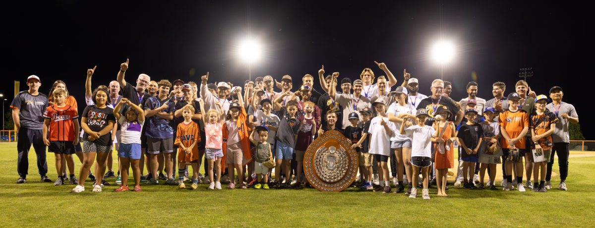 Group photo of baseball team and fans