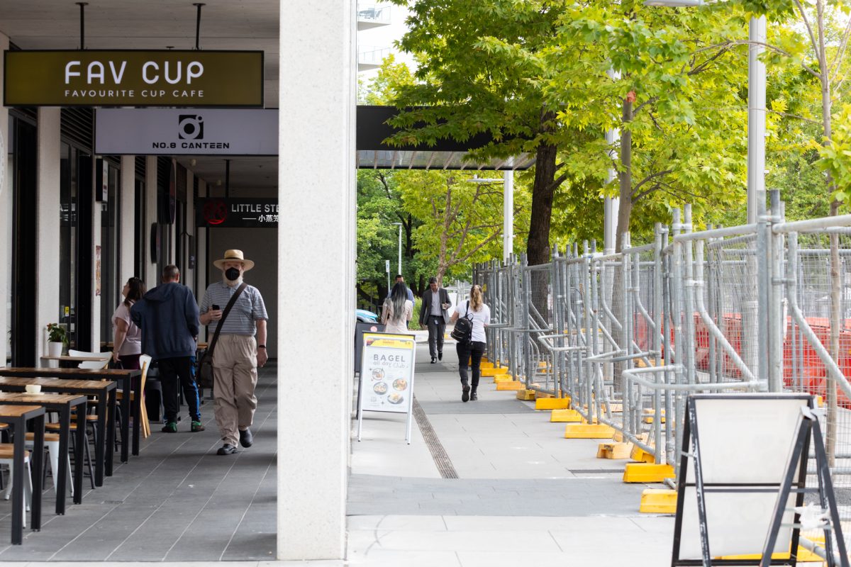 Construction fencing near city cafes