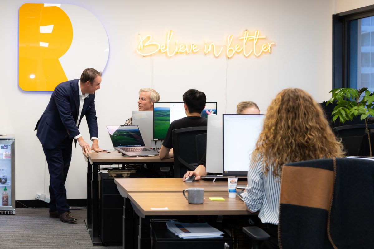 people in an office talking